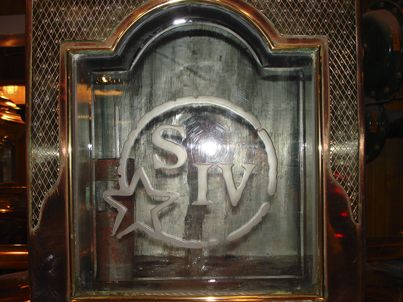 The Star Hill Farm logo on the spirit safe at Maker's Mark Distillery. File photo ©2025, Mark Gillespie/CaskStrength Media.