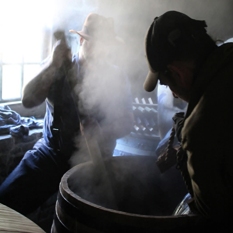 Distillers Erik Wolfe and Alan Bishop making a mash. Image courtesy Wolfe & Wilson.